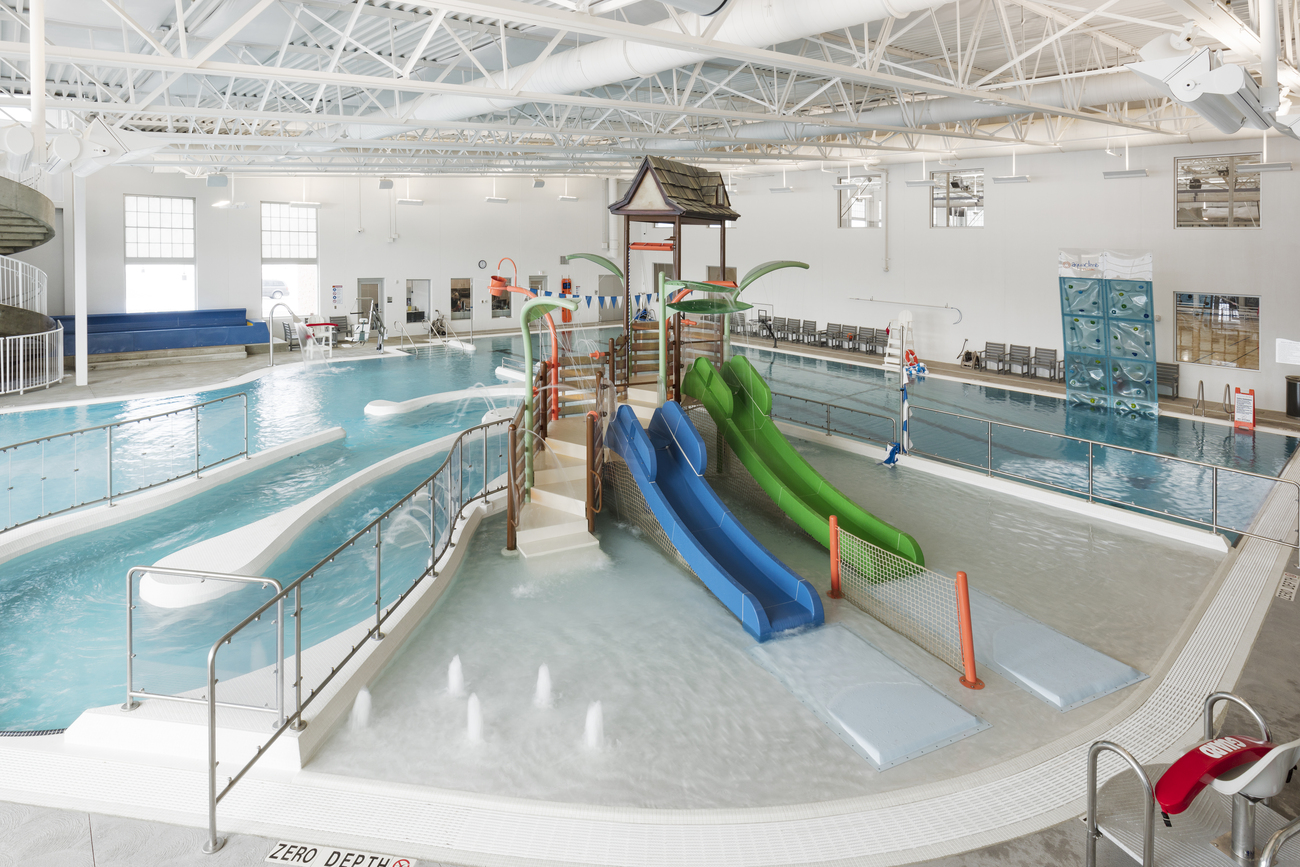 Slides installed in a large commercial pool.