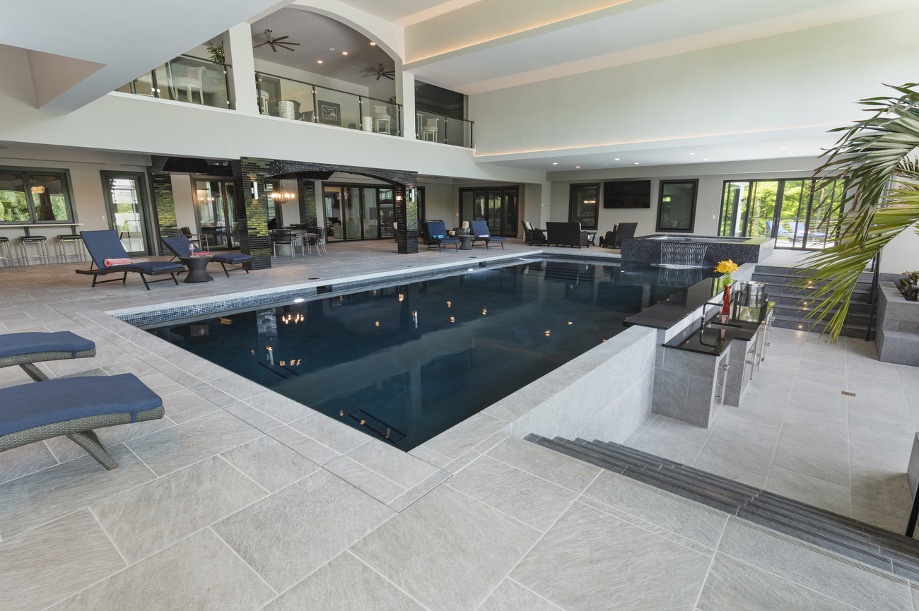 Indoor rectangular pool at a residential property.