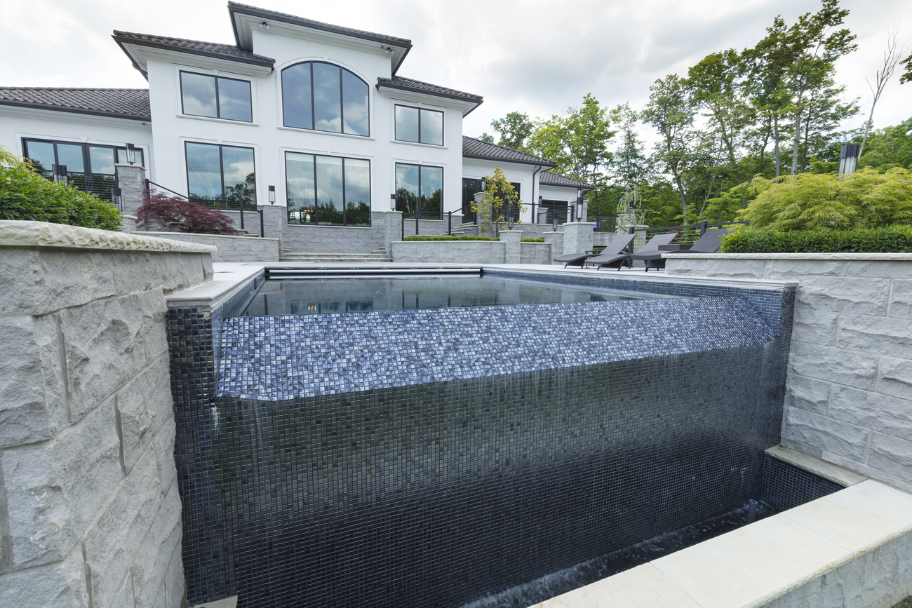 Water fountain with small blue tiles.