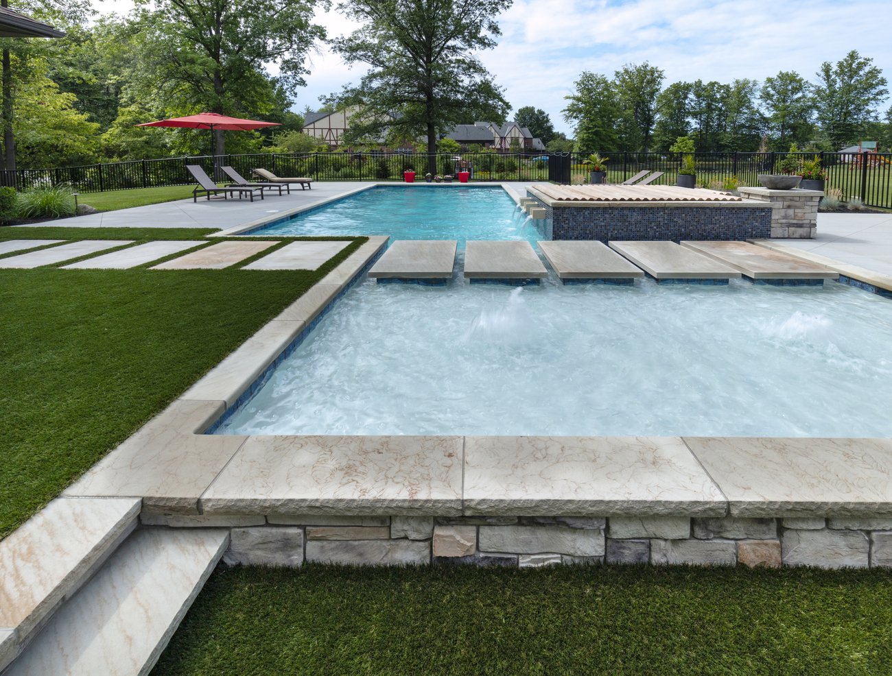 Close up of stone patio added to residential pool.