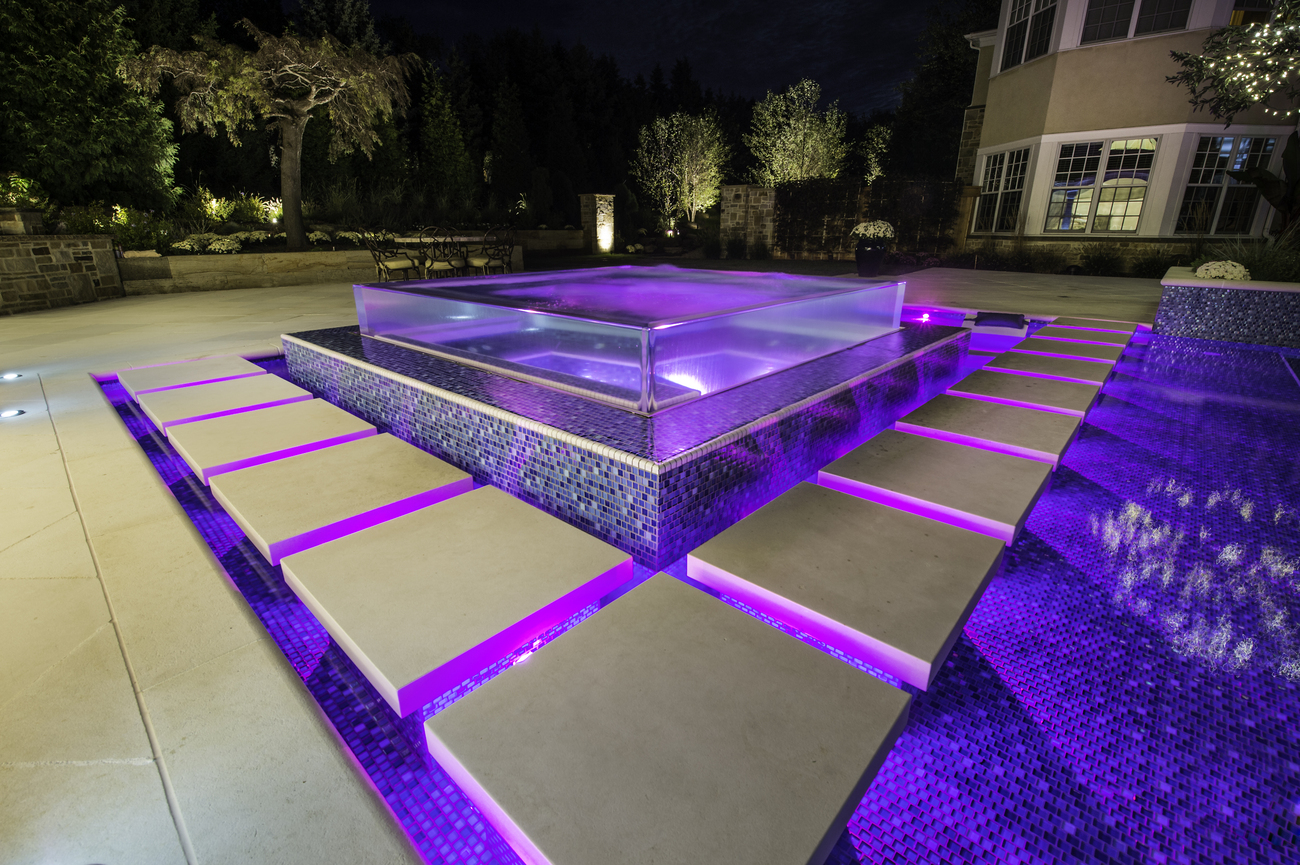 Water feature installed with purple lights.