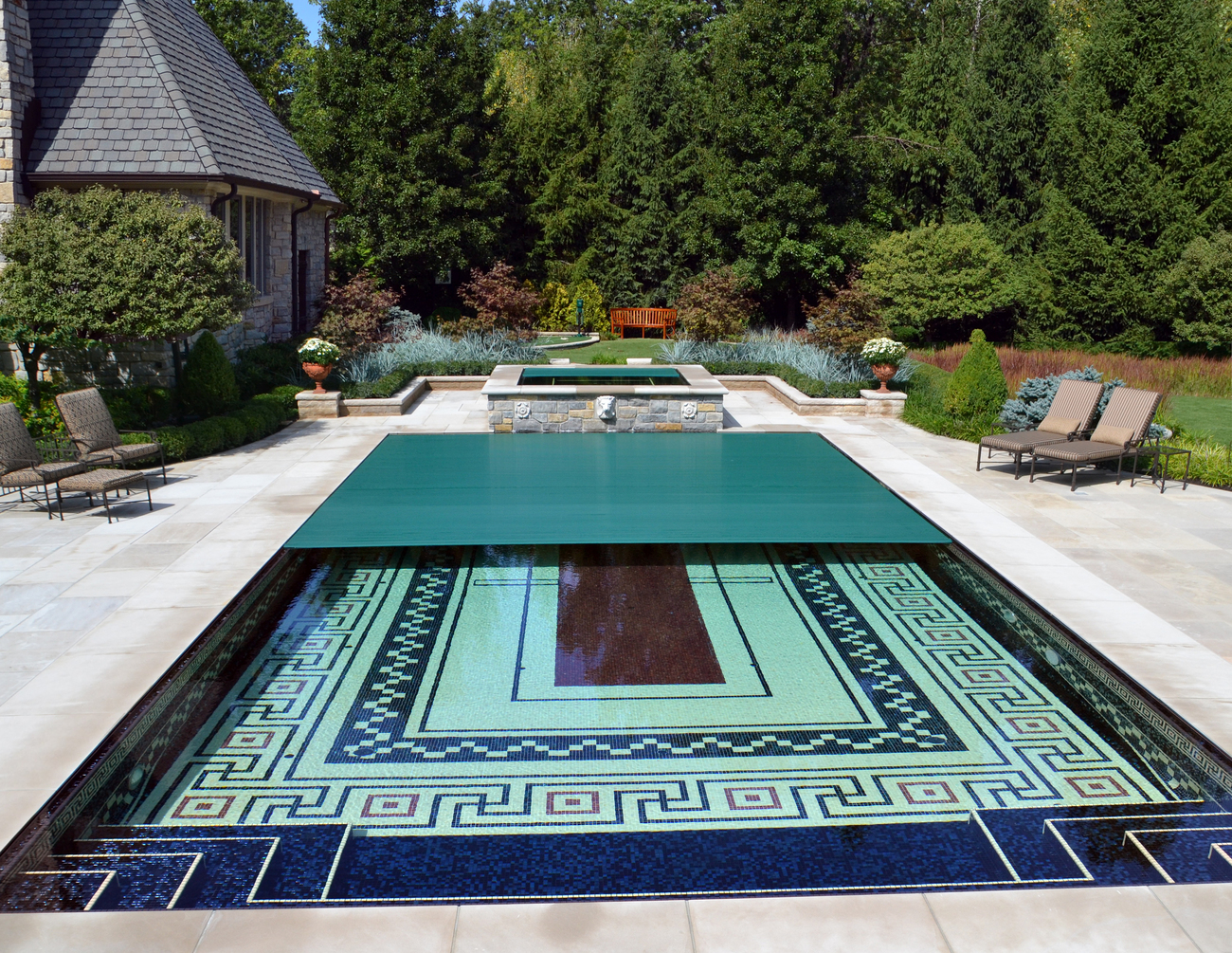 Rectangular pool installed with geometric tiles.