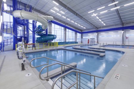 Steps leading into a commercial indoor pool.