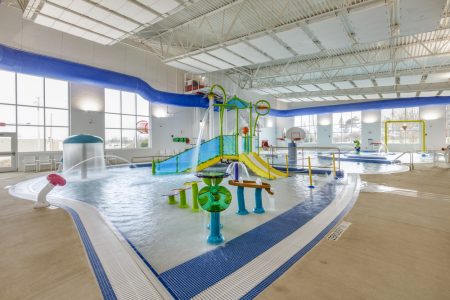 Children's play area installed in indoor commercial swimming pool.