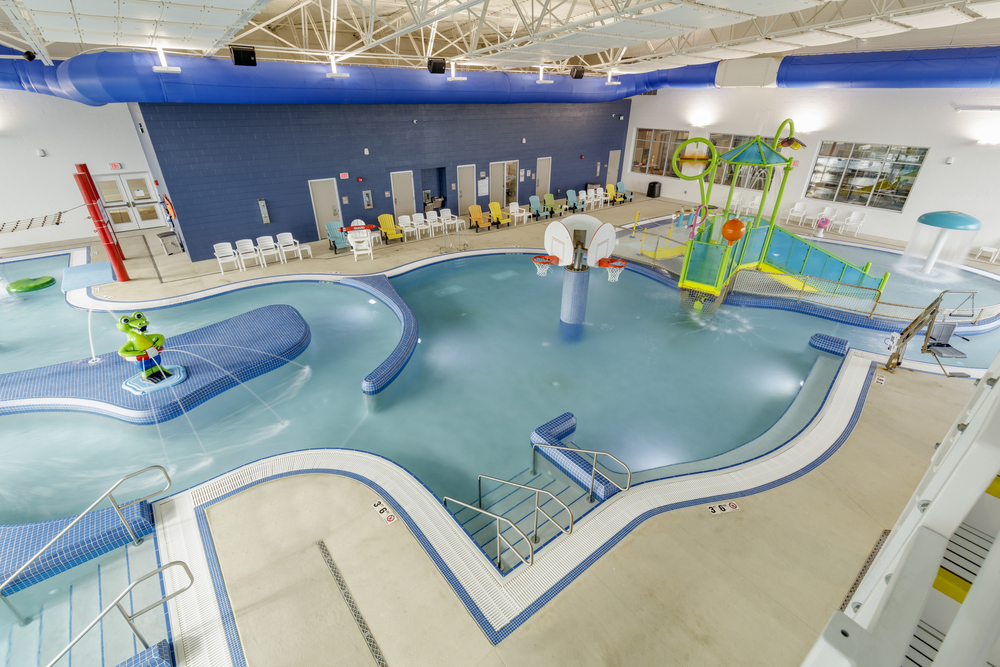 Aerial view of basketball hoops installed in a commercial indoor swimming pool.