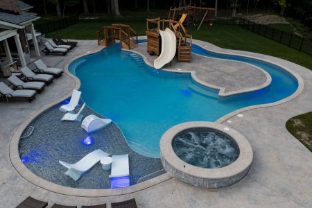 residential swimming pool with wooden waterslide