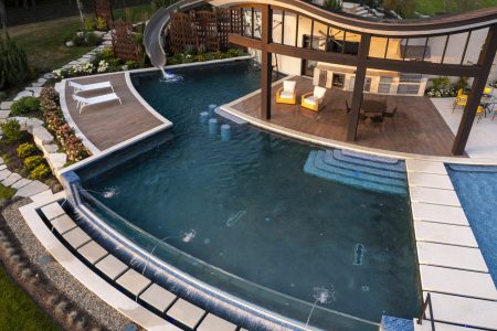 custom swimming pool with water slide and fountains