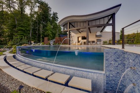 luxury raised swimming pool with fountains and clear wall